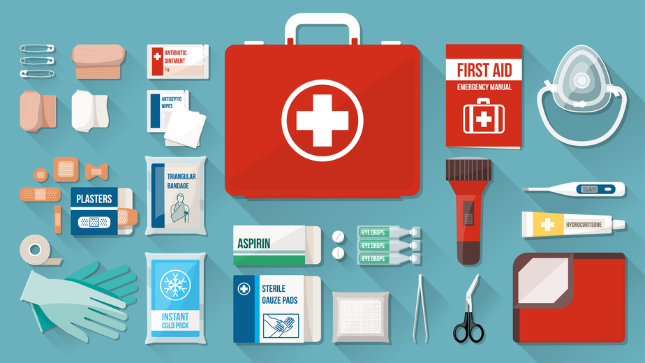 First aid kit box with medical equipment and medications for emergency, objects top view